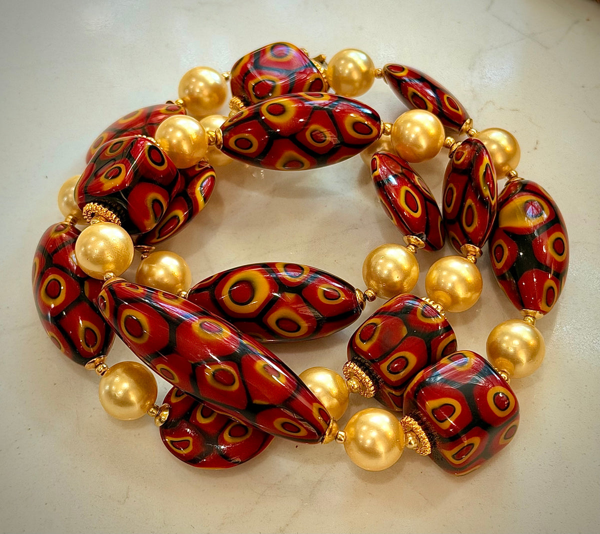 Rosario Leonardi Golden Shell Pearl With Moretti Red, Yellow & Black Beaded Necklace