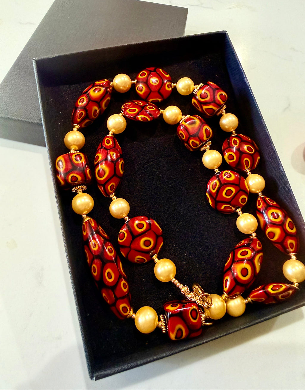 Rosario Leonardi Golden Shell Pearl With Moretti Red, Yellow & Black Beaded Necklace