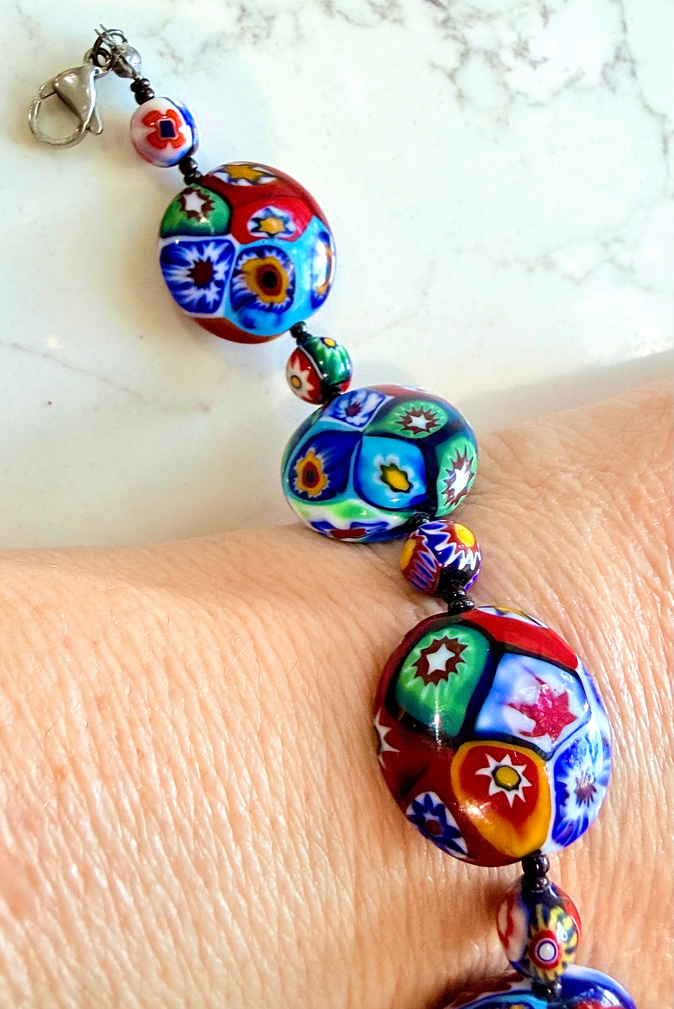 Rosario Leonardi Beaded Coin Shaped Bracelet Featuring Ercole Moretti Red & Blue Flower Patterned  Beads