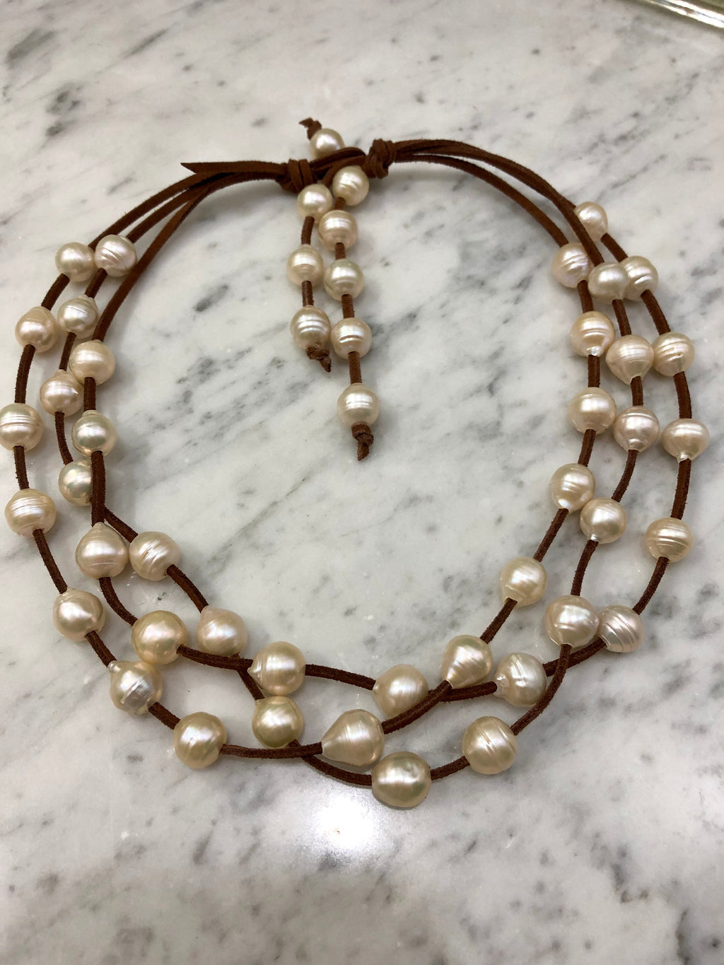 3 Strand Huge freshwater pearls on vegan suede.