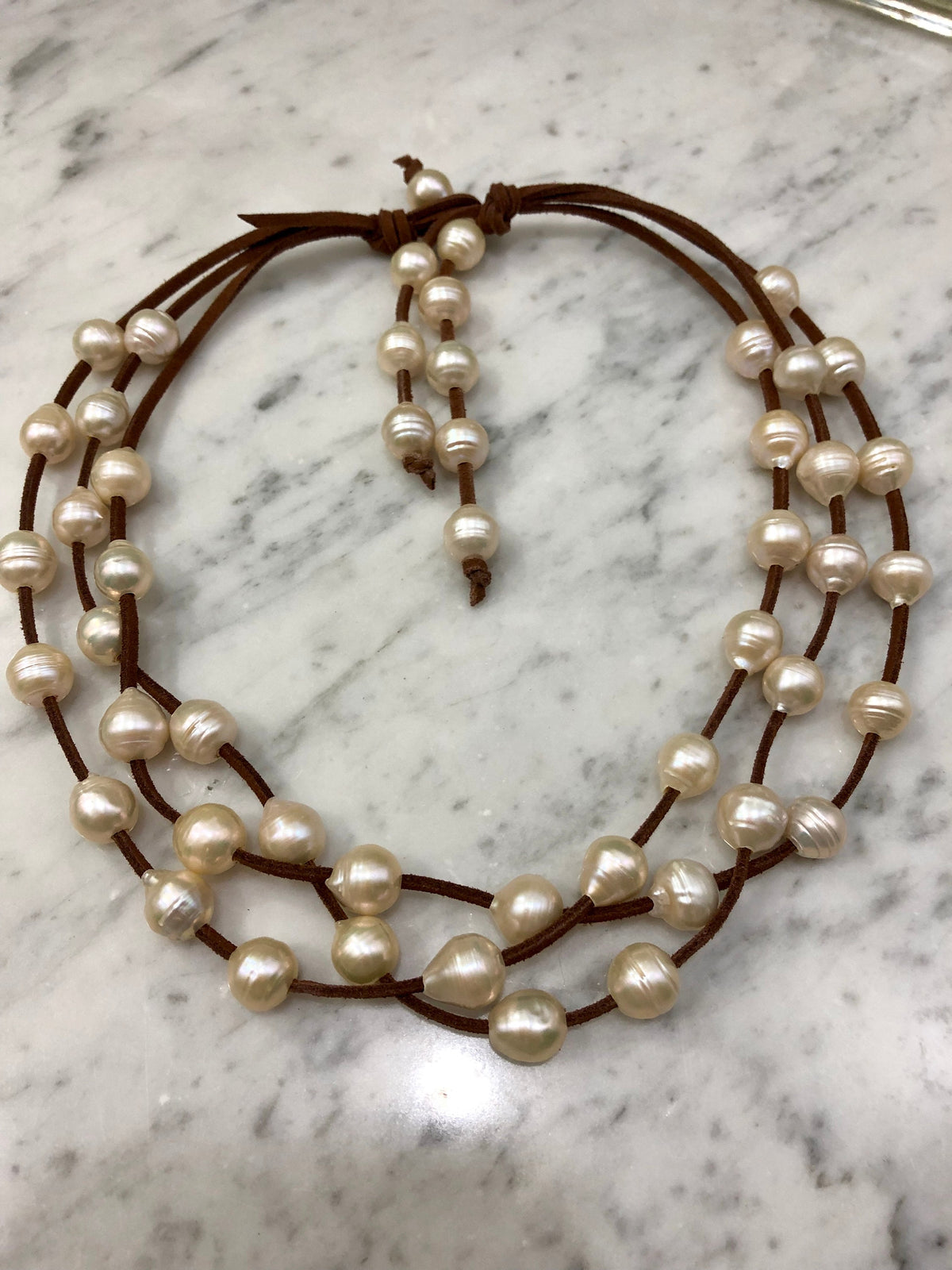 3 Strand Huge freshwater pearls on vegan suede.
