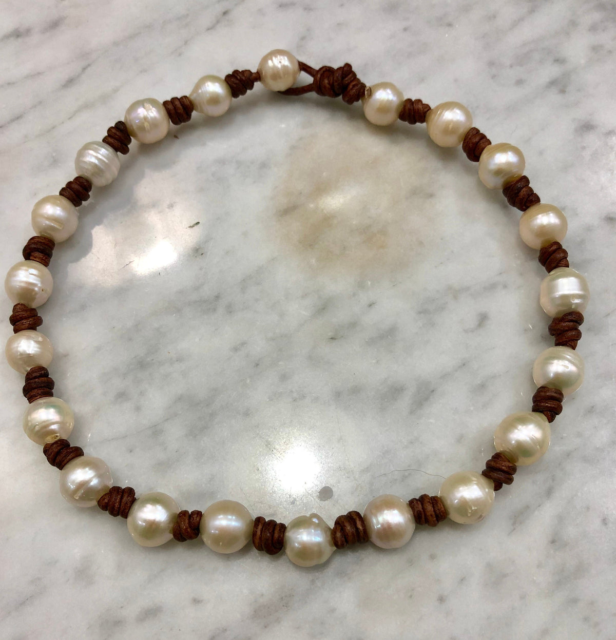 White Freshwater Pearls on Knotted Brown Leather