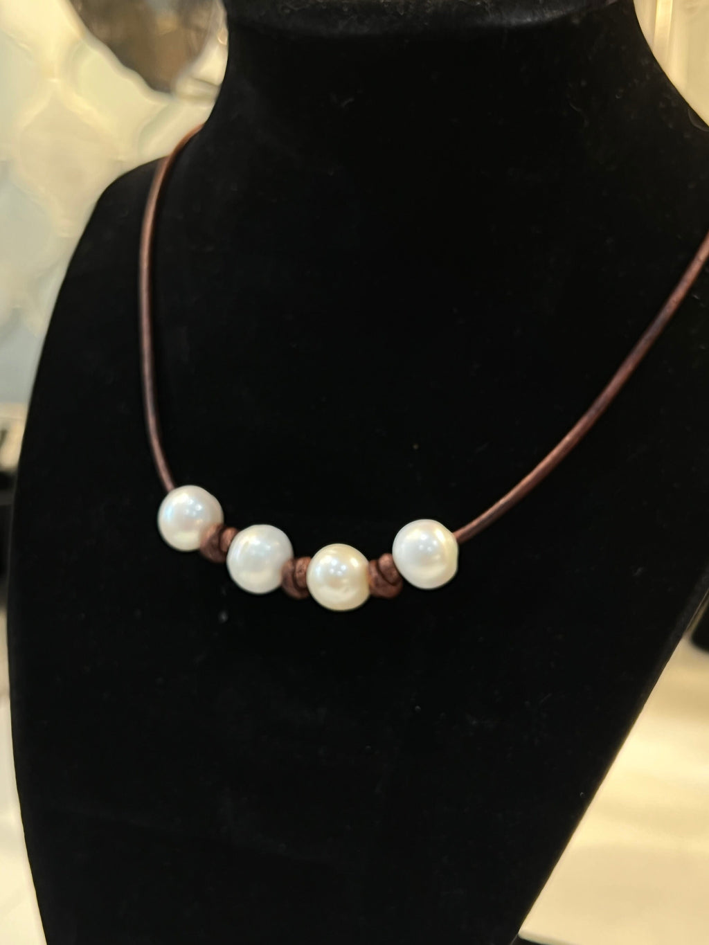 Four Pearl Necklace on knotted brown leather