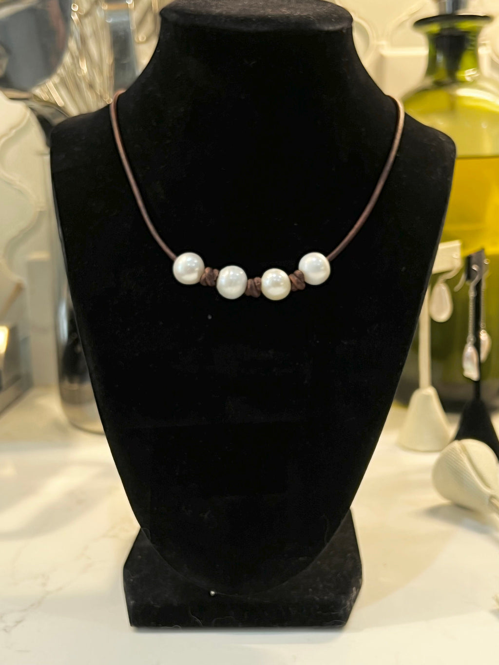 Four Pearl Necklace on knotted brown leather