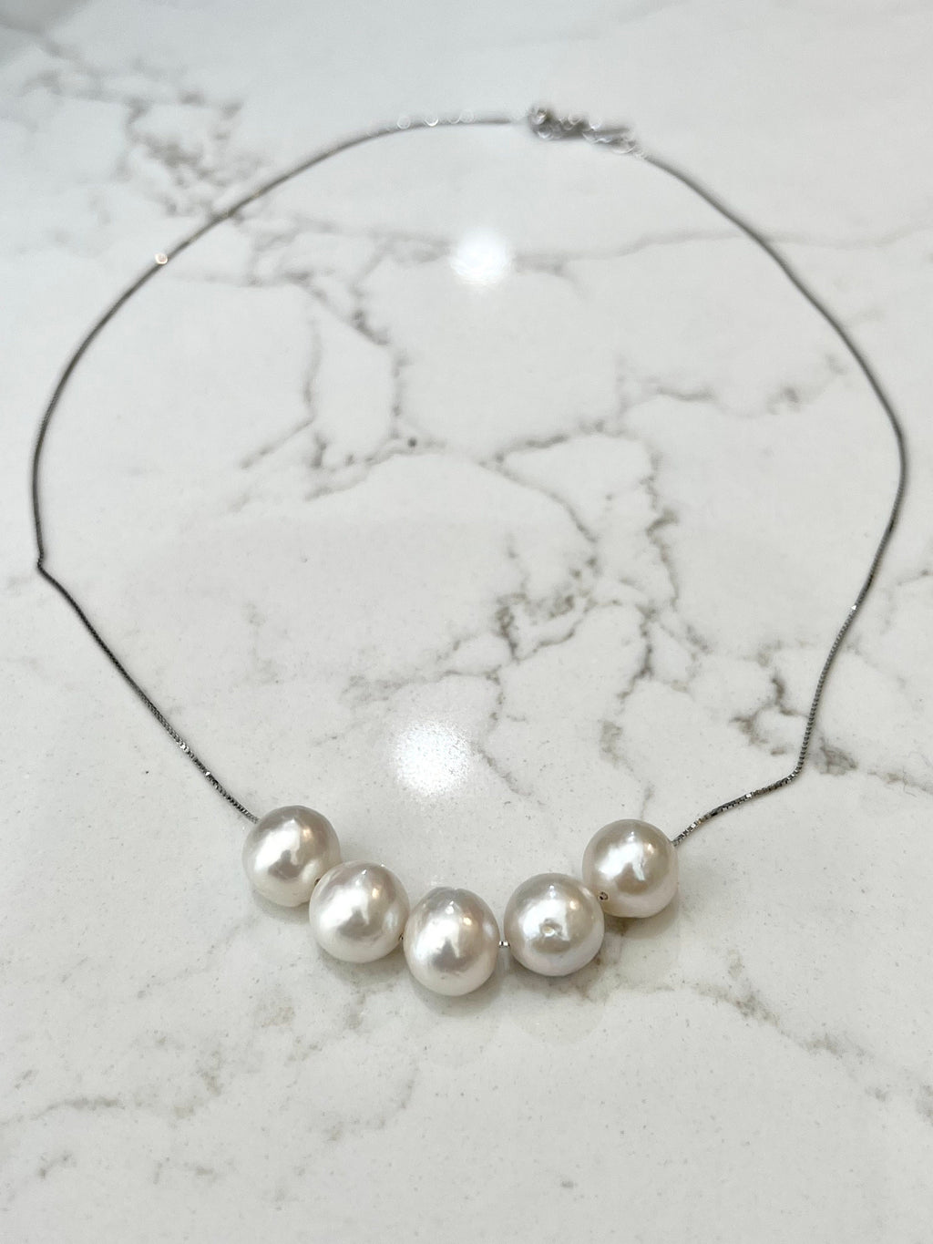 Five Floating White Pearls  on 17.5” Sterling Silver necklace