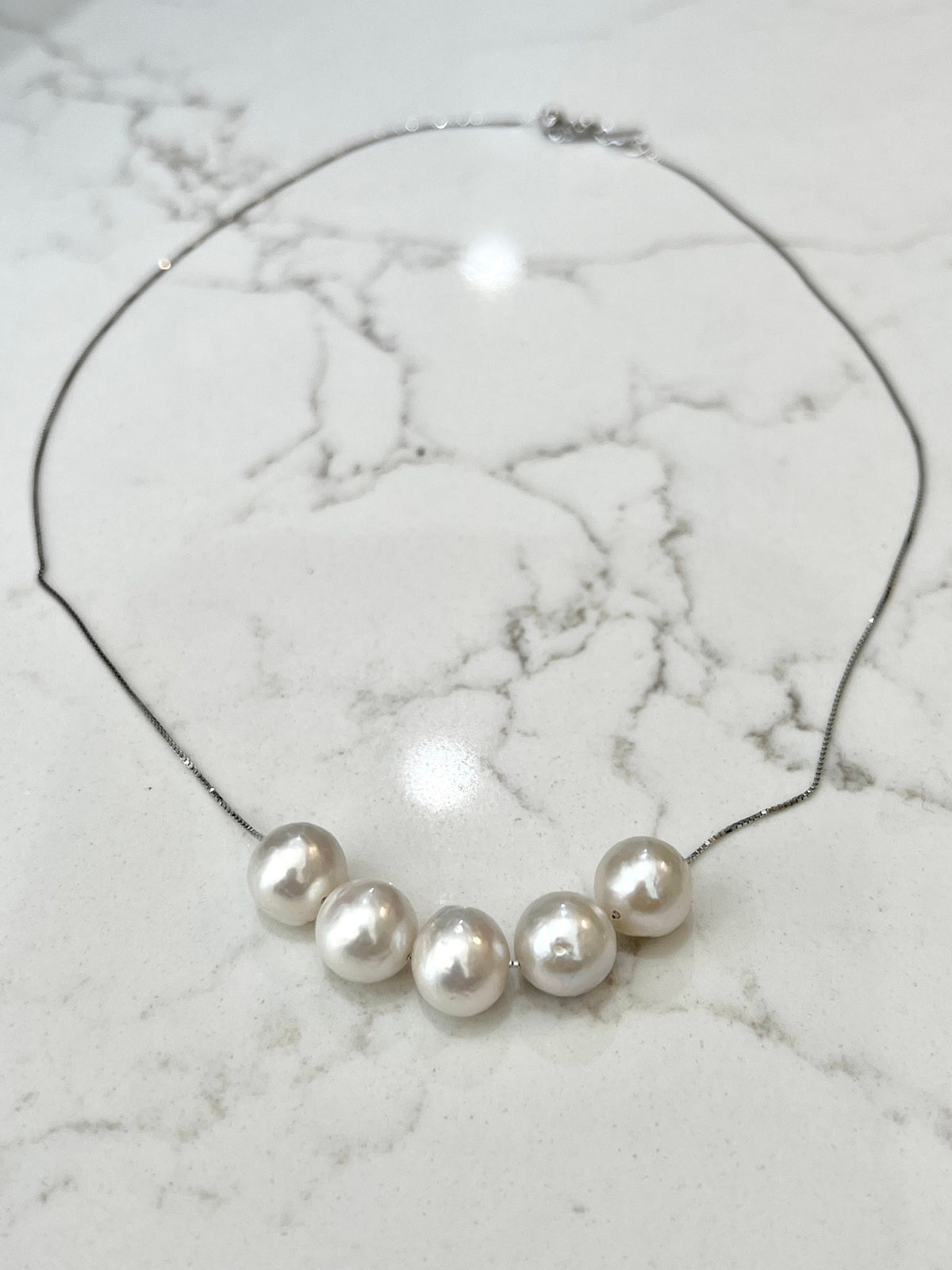 Five Floating White Pearls  on 17.5” Sterling Silver necklace