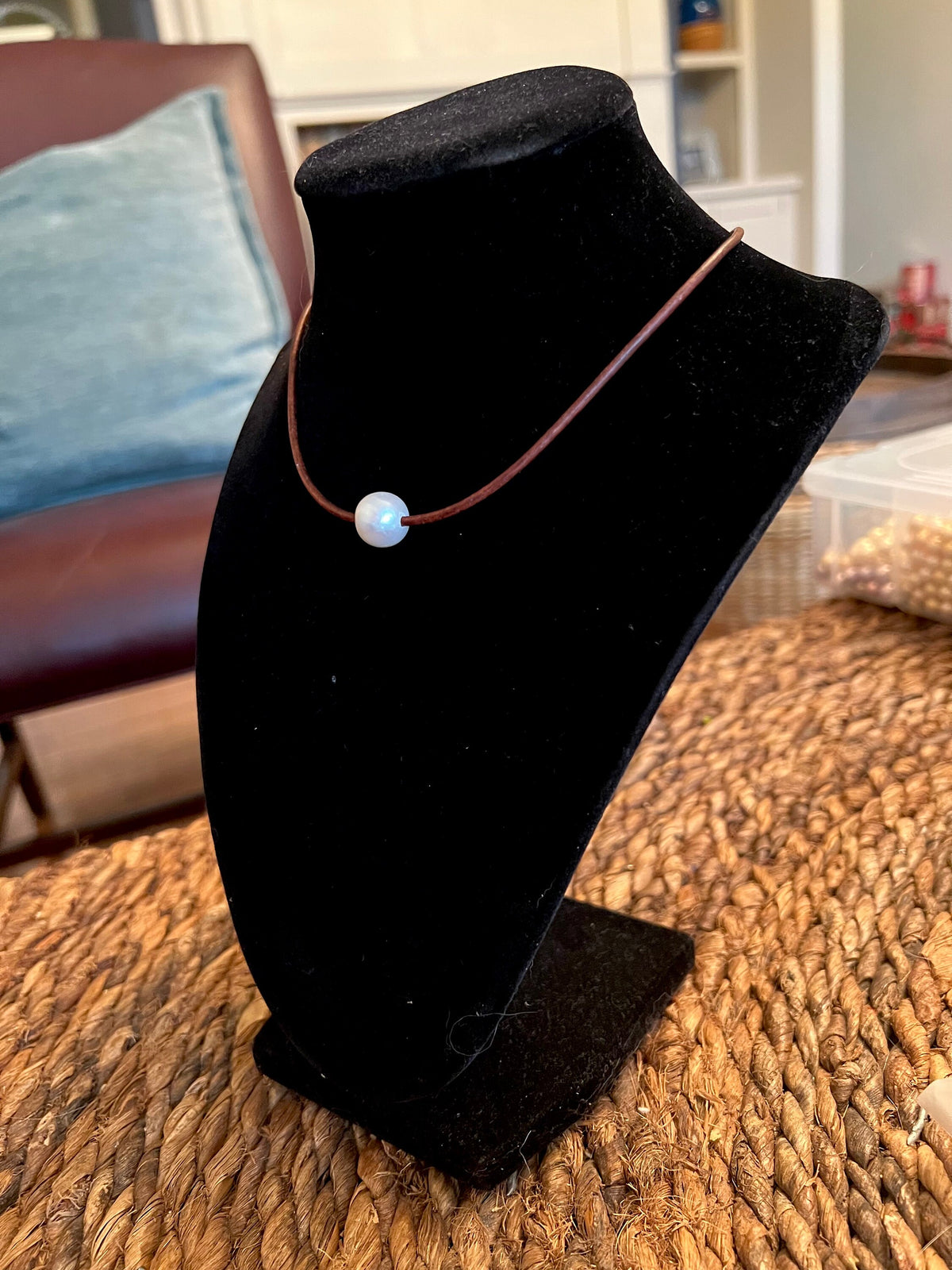 Floating White Pearl on Brown Leather