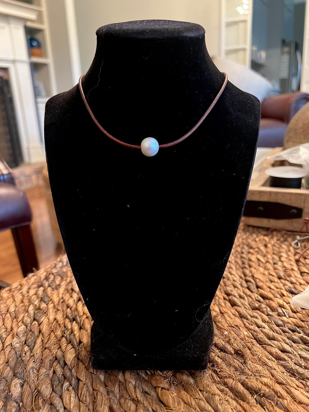 Floating White Pearl on Brown Leather
