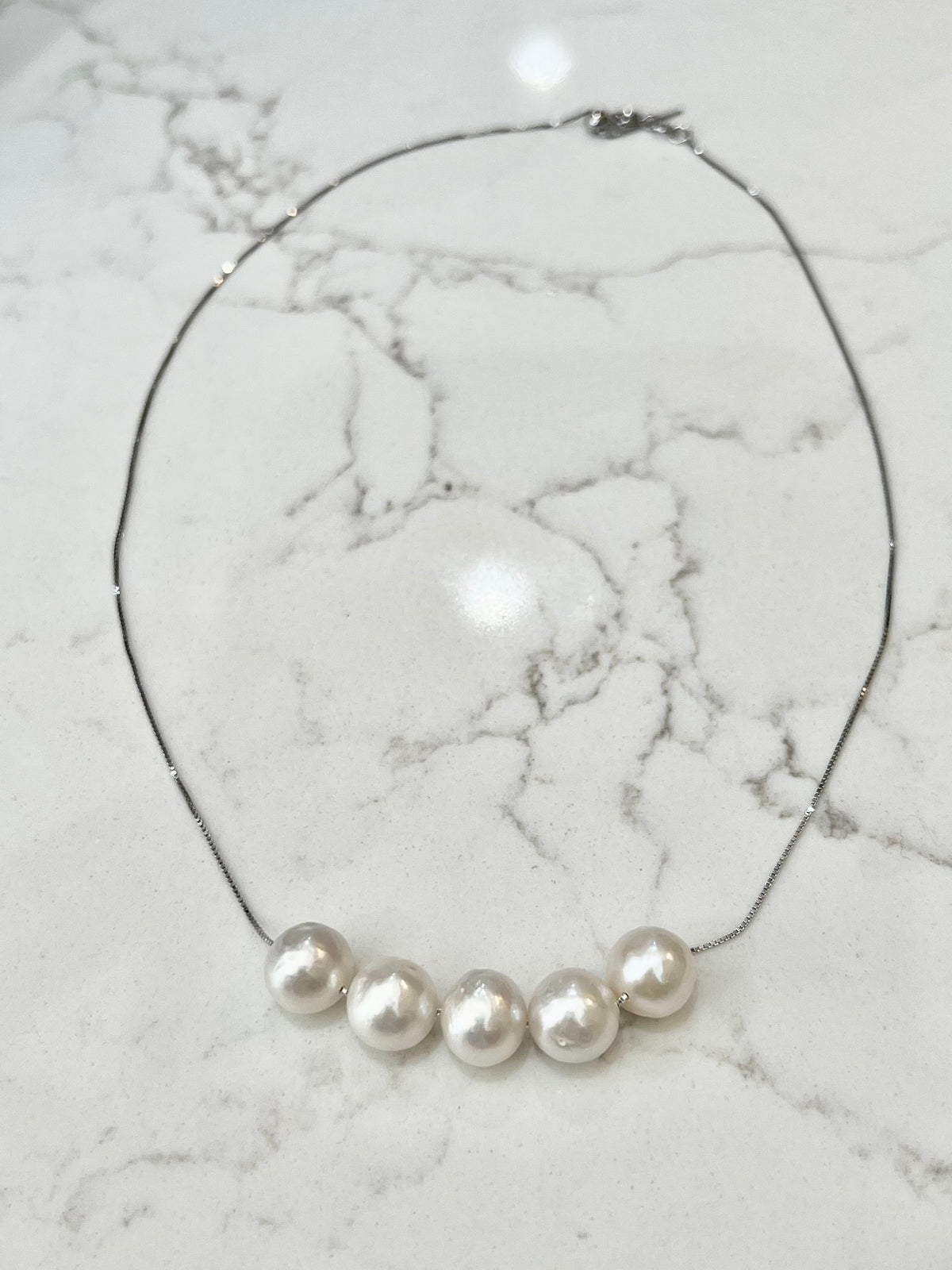 Five Floating White Pearls  on 17.5” Sterling Silver necklace