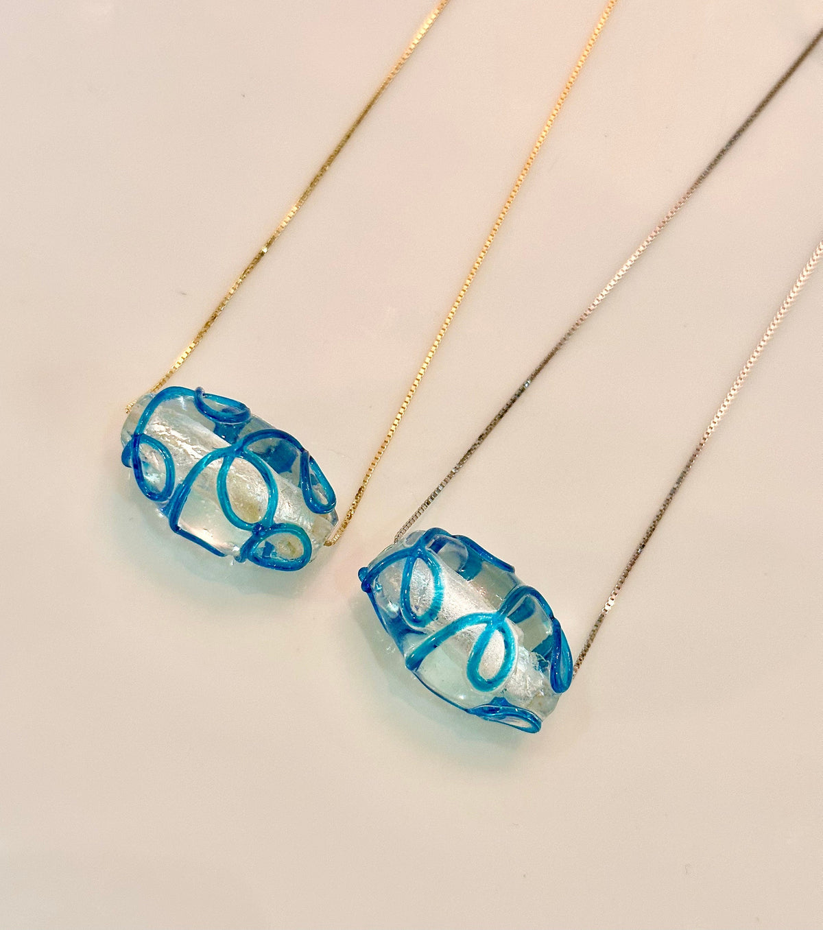 Hand-Blown Oval Clear and Ocean Blue Glass on Sterling Silver Chain