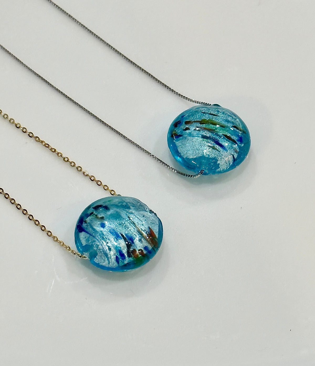 Handmade Iridescent Sky Blue Swirled Murano Glass on Sterling Chain