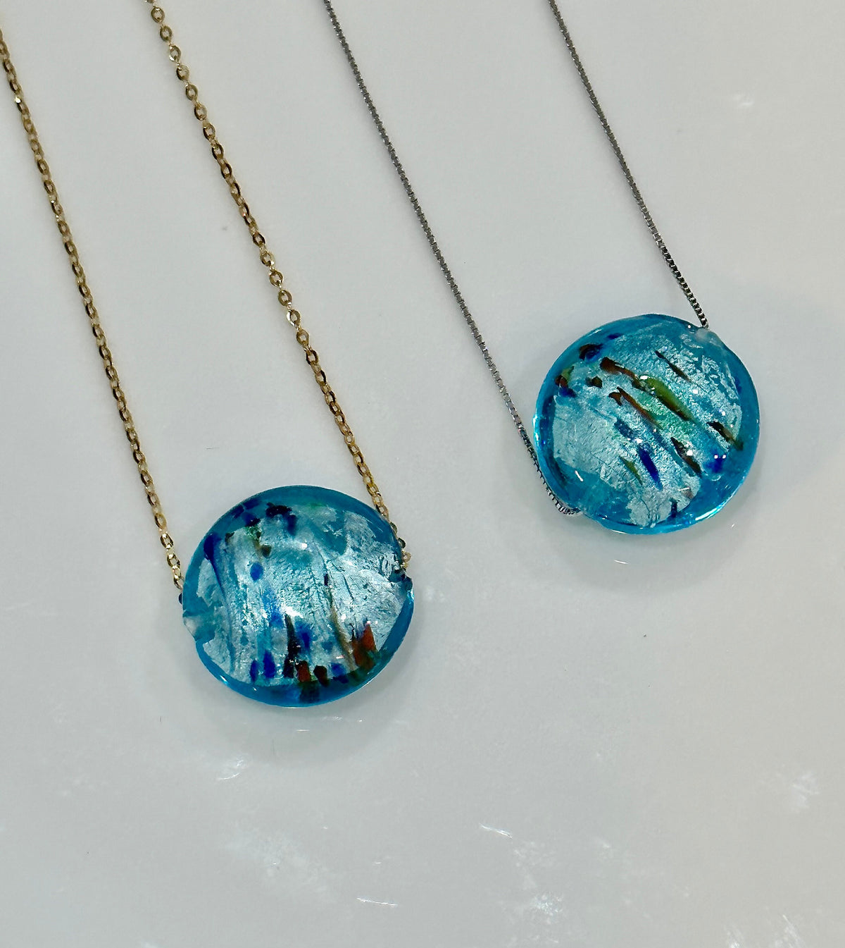 Handmade Iridescent Sky Blue Swirled Murano Glass on Sterling Chain