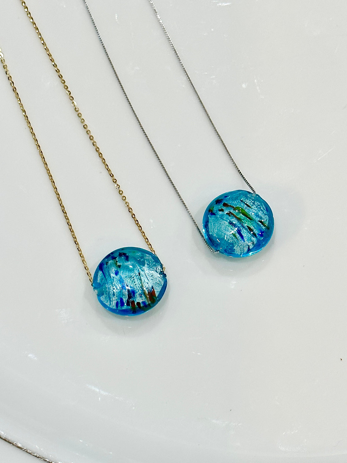 Handmade Iridescent Sky Blue Swirled Murano Glass on Sterling Chain