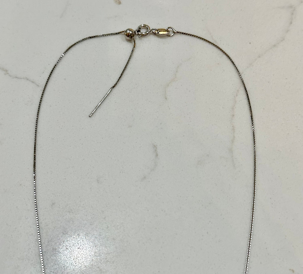 This is the sterling silver chain that comes with the necklace. It’s a 16” adjustable chain.