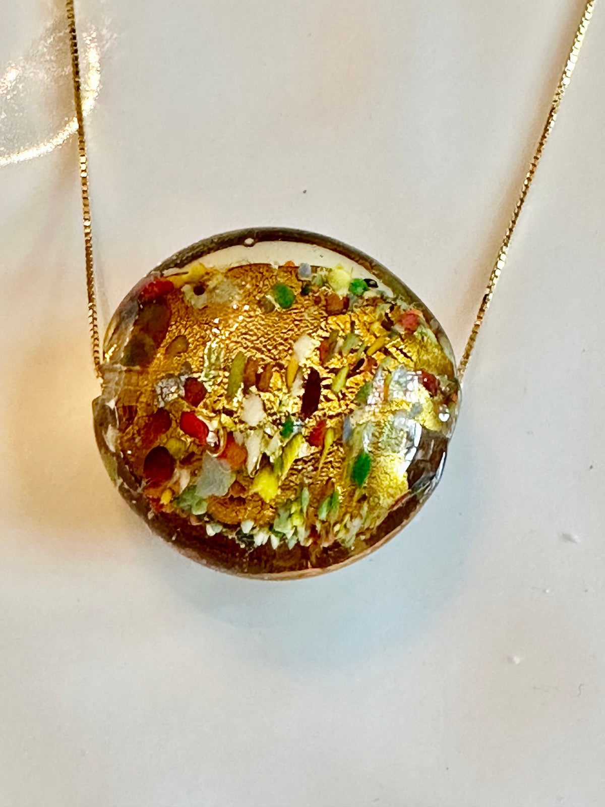 35mm Gold Foil with iridescent color Lampwork Glass on a Sterling chain with a hand made pearl extender.