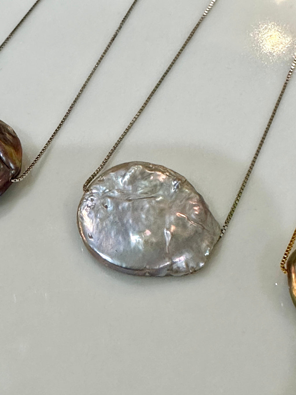 Sterling Silver Chain with a floating Iridescent Purple or Silver Coin Pearl