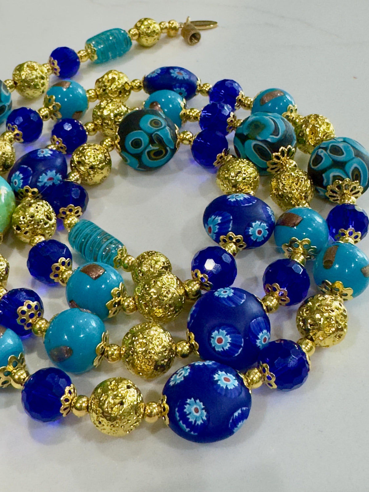 Uncirculated Vintage Millefiori Murano Glass Necklace Made From Gold, Cobalt, and Aqua Hues.