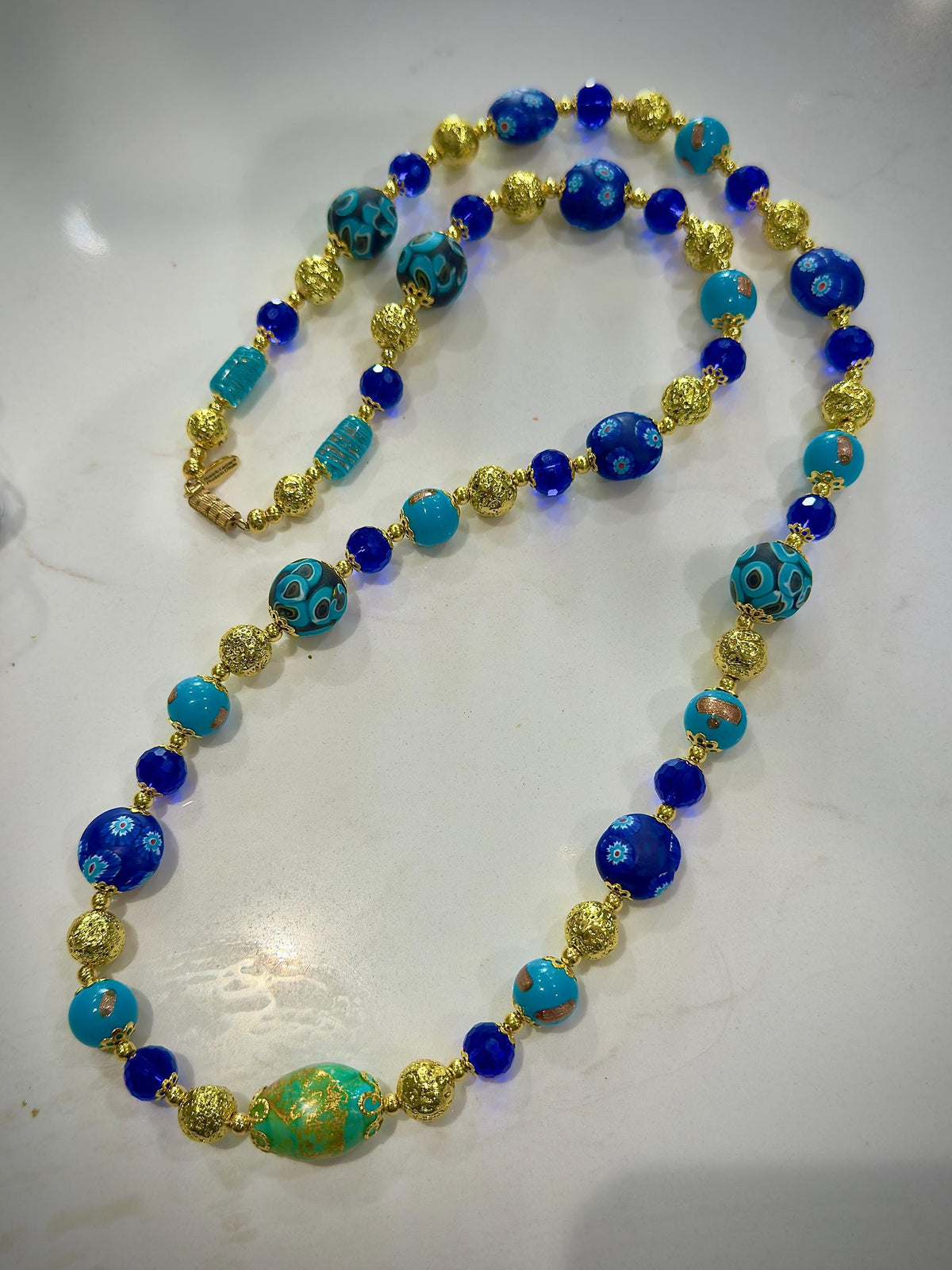 Uncirculated Vintage Millefiori Murano Glass Necklace Made From Gold, Cobalt, and Aqua Hues.