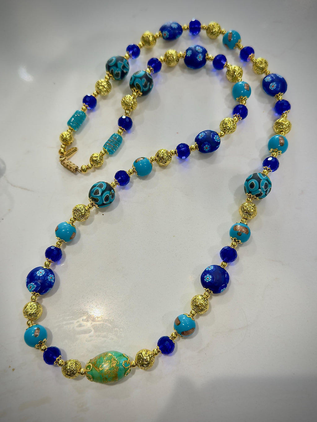 Uncirculated Vintage Millefiori Murano Glass Necklace Made From Gold, Cobalt, and Aqua Hues.