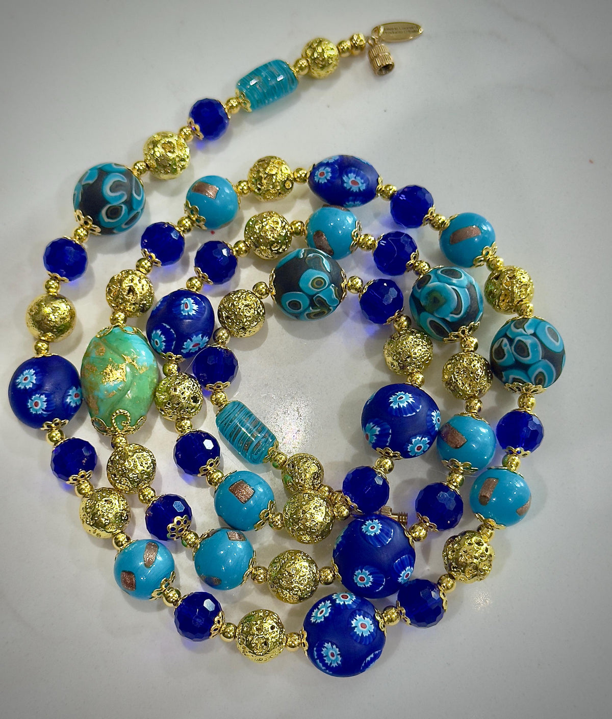 Uncirculated Vintage Millefiori Murano Glass Necklace Made From Gold, Cobalt, and Aqua Hues.