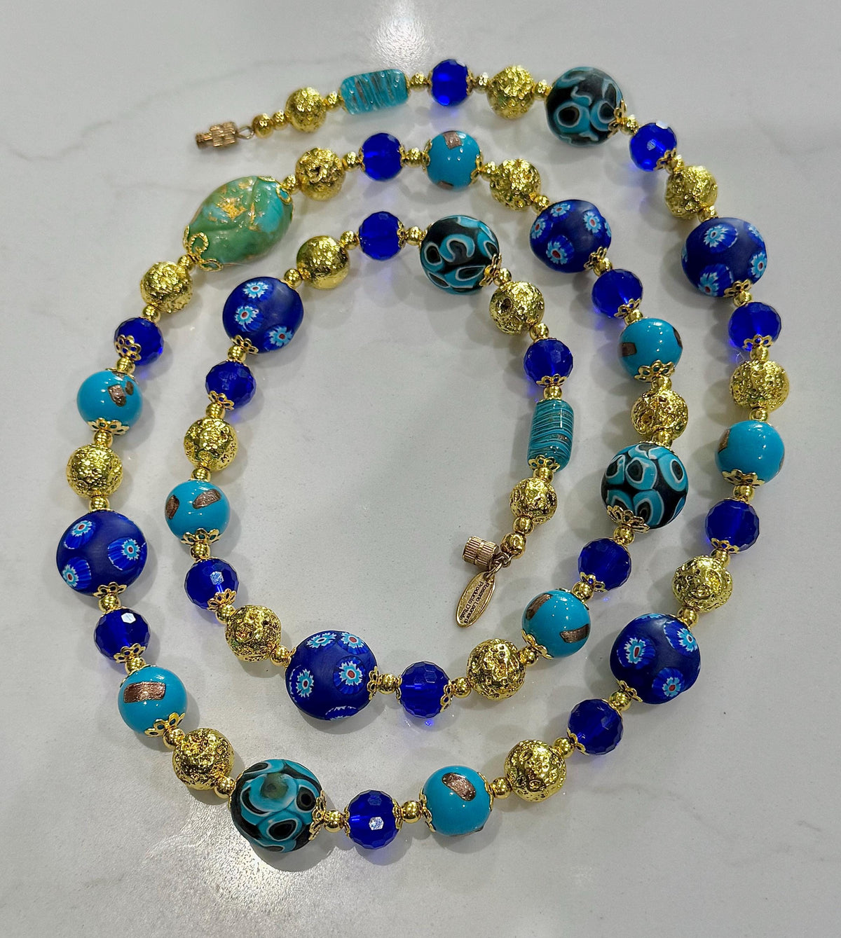 Uncirculated Vintage Millefiori Murano Glass Necklace Made From Gold, Cobalt, and Aqua Hues.