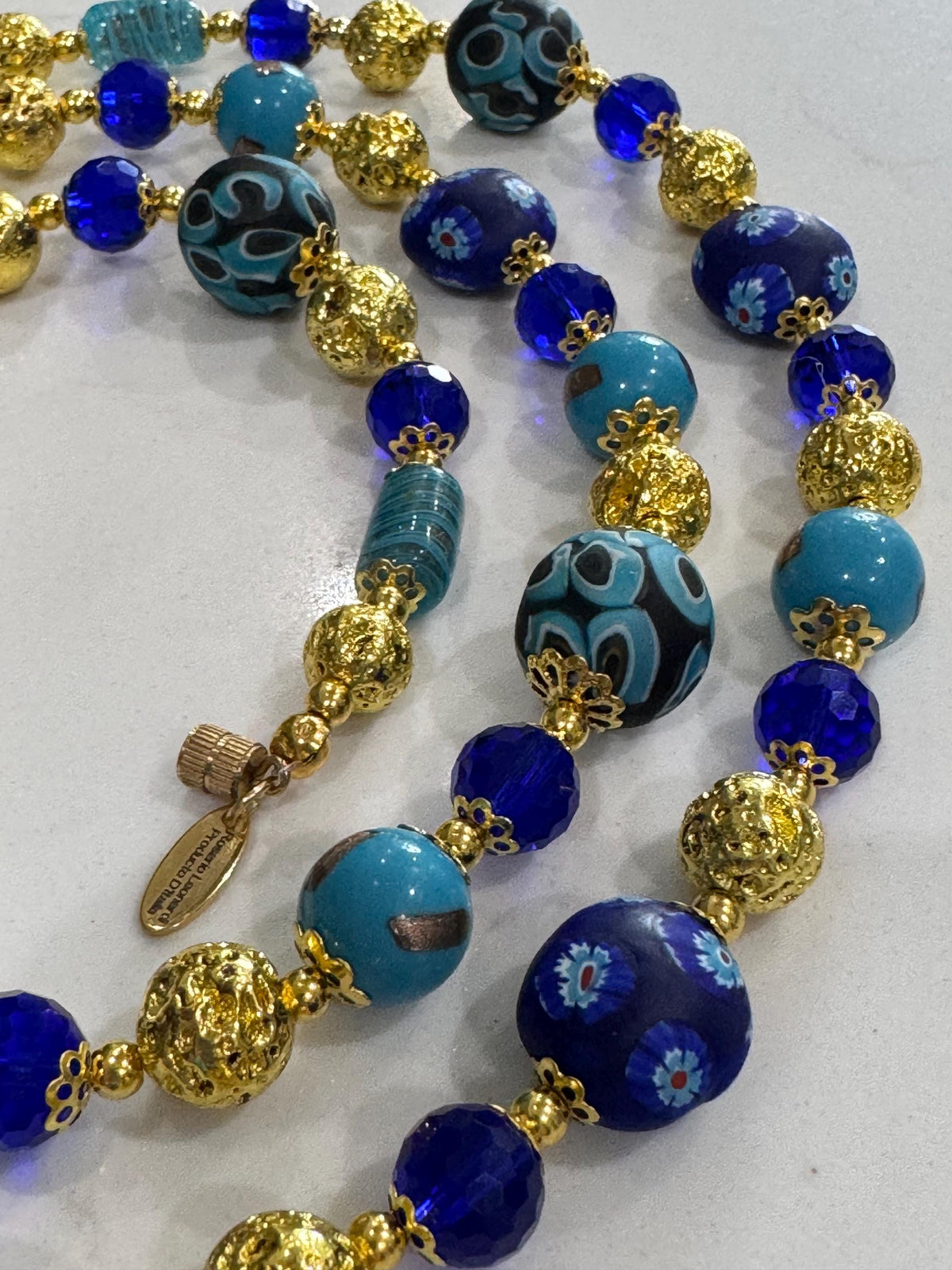 Uncirculated Vintage Millefiori Murano Glass Necklace Made From Gold, Cobalt, and Aqua Hues.